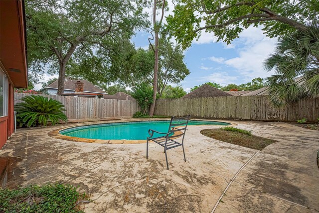 2823 W Pebble Beach Dr, Missouri City, TX 77459 - view of pool featuring a fenced backyard and a patio