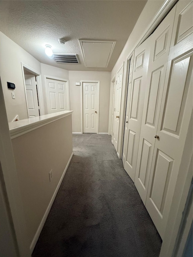 13202 Chasworth Dr, Houston, TX 77041 - hallway with attic access, carpet, and a textured ceiling