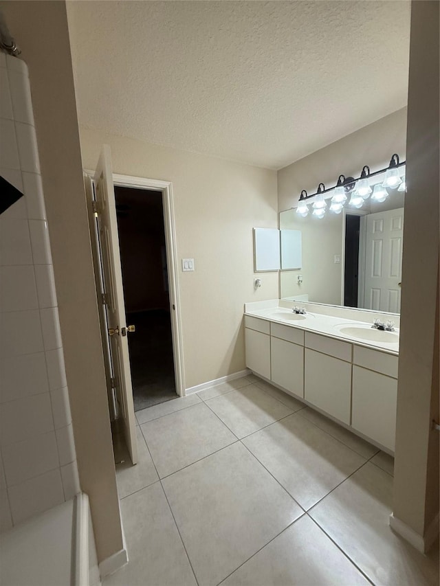 13202 Chasworth Dr, Houston, TX 77041 - full bathroom with a textured ceiling, double vanity, tile patterned flooring, and a bath