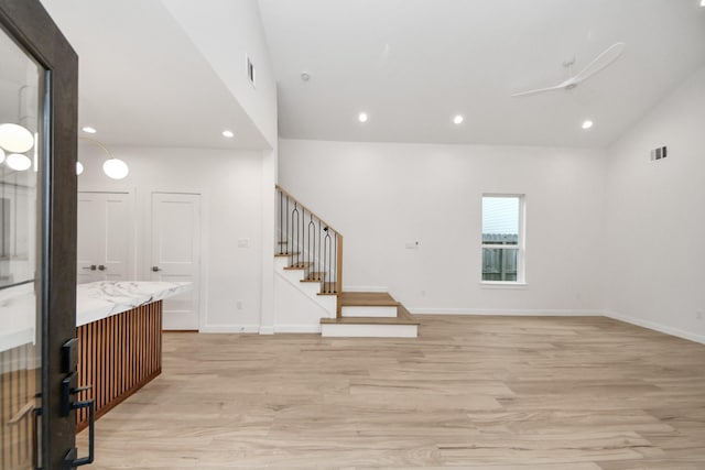 3907 Sumpter St, Houston, TX 77020 - interior space with light wood-style flooring, stairs, lofted ceiling, and recessed lighting