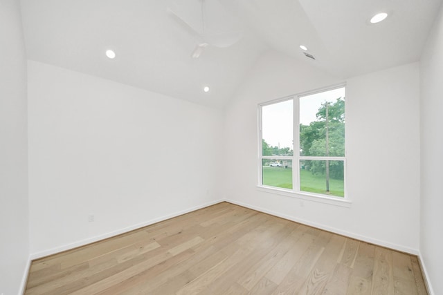 3907 Sumpter St, Houston, TX 77020 - empty room featuring light wood-style floors, lofted ceiling, and recessed lighting