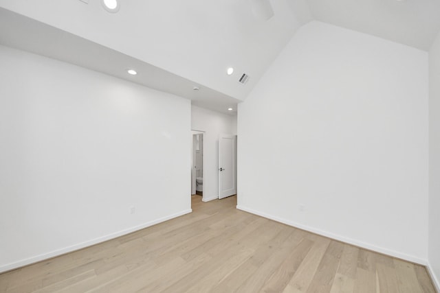3907 Sumpter St, Houston, TX 77020 - spare room featuring light wood-type flooring, recessed lighting, and high vaulted ceiling