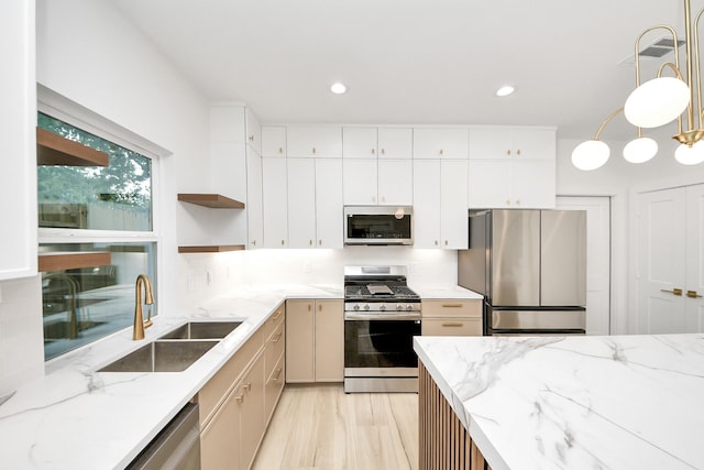 3907 Sumpter St, Houston, TX 77020 - kitchen with stainless steel appliances, open shelves, decorative backsplash, recessed lighting, and light stone countertops