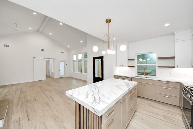 3907 Sumpter St, Houston, TX 77020 - kitchen with open shelves, a kitchen island, gas range, high vaulted ceiling, and open floor plan