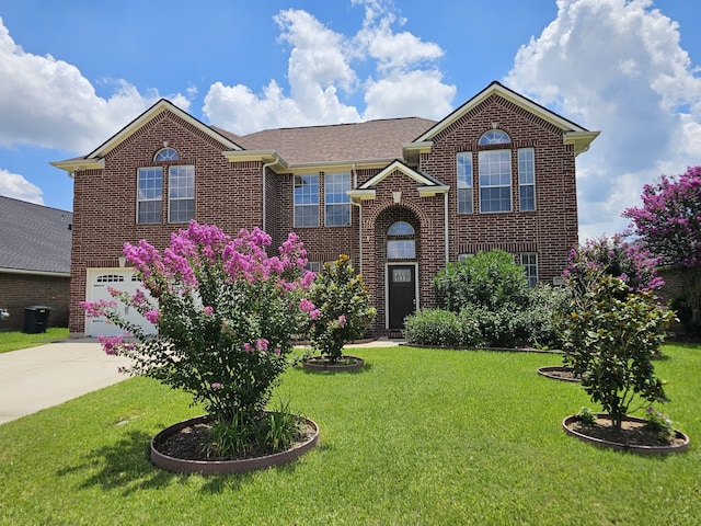 8123 Cove Timbers Ln, Tomball, TX 77375 - traditional-style house with brick siding, driveway, an attached garage, and a front lawn