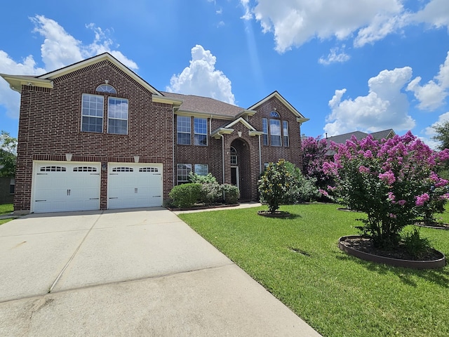 8123 Cove Timbers Ln, Tomball, TX 77375 - view of front facade featuring concrete driveway, a front yard, an attached garage, and brick siding