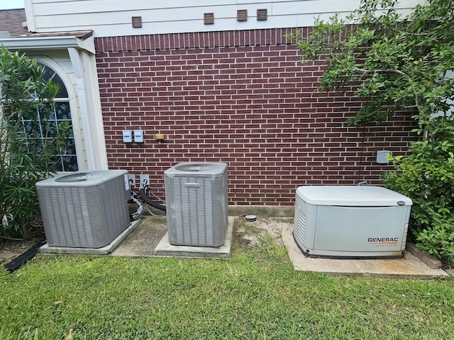 8123 Cove Timbers Ln, Tomball, TX 77375 - exterior view of a power unit and a central air condition unit