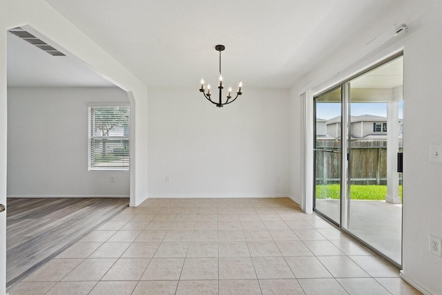 2607 Ensbrook Meadow Ln, Katy, TX 77449 - spare room featuring a chandelier and light tile patterned floors