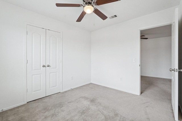 2607 Ensbrook Meadow Ln, Katy, TX 77449 - unfurnished bedroom with carpet flooring, a closet, and a ceiling fan