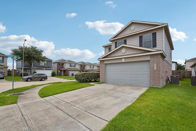 2607 Ensbrook Meadow Ln, Katy, TX 77449 - traditional-style house with brick siding, driveway, a residential view, and a garage