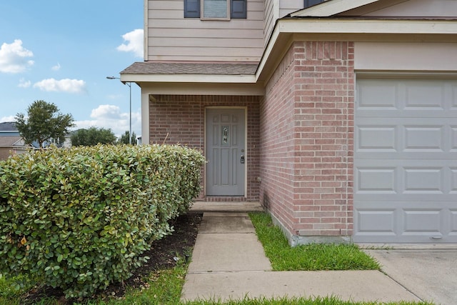 2607 Ensbrook Meadow Ln, Katy, TX 77449 - doorway to property with brick siding and a garage