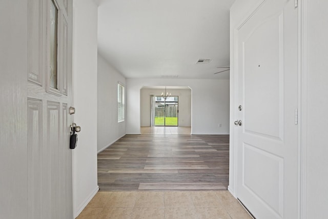 2607 Ensbrook Meadow Ln, Katy, TX 77449 - hall featuring a chandelier and light tile patterned flooring