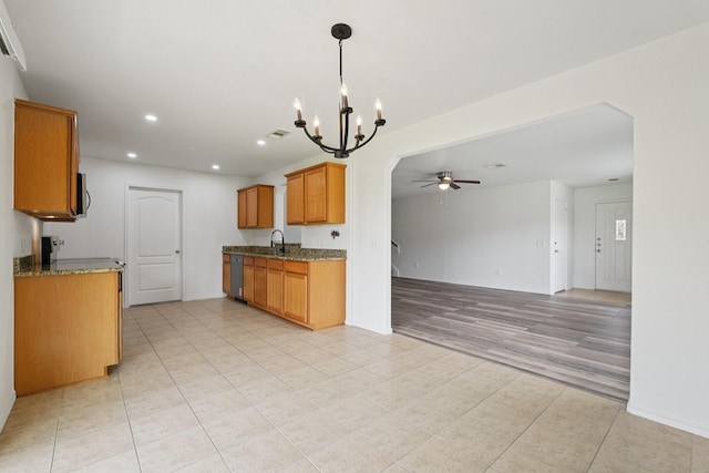 2607 Ensbrook Meadow Ln, Katy, TX 77449 - kitchen featuring a chandelier, ceiling fan, open floor plan, appliances with stainless steel finishes, and light tile patterned flooring