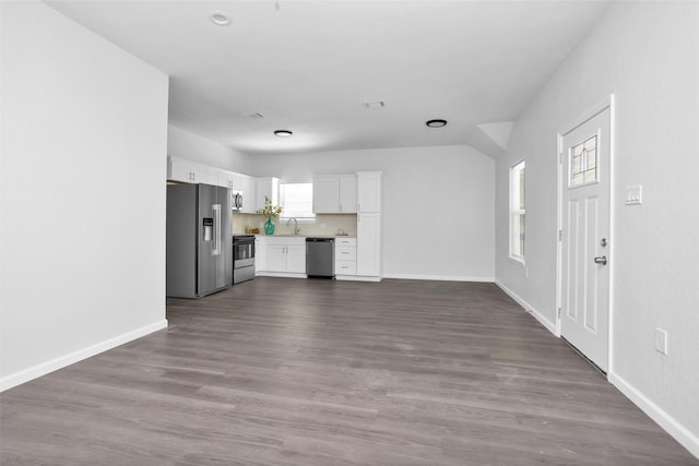 4412 Sayers St, Houston, TX 77026 - unfurnished living room featuring a sink and dark wood-style flooring