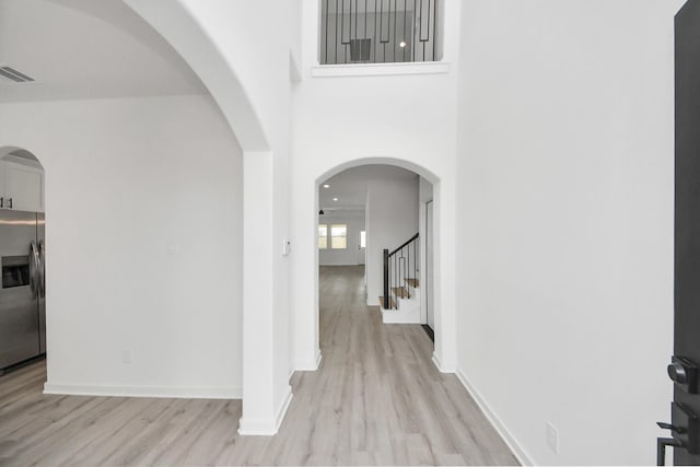 5318 Latigo Ct, Alvin, TX 77511 - entryway with light wood-style floors and stairway
