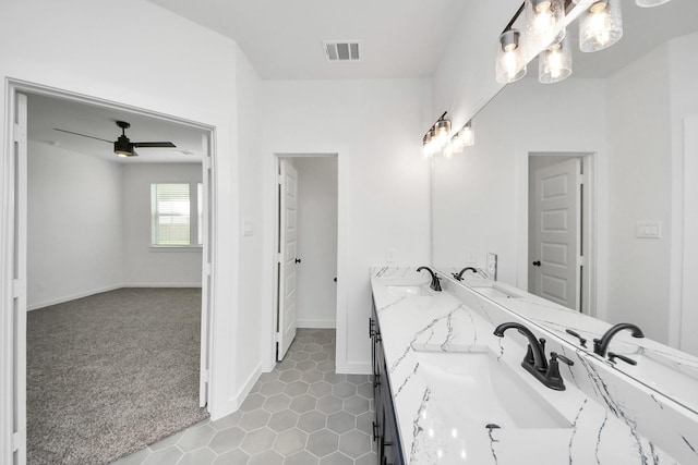 5318 Latigo Ct, Alvin, TX 77511 - bathroom featuring double vanity, a ceiling fan, tile patterned floors, and a chandelier
