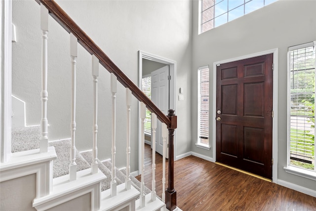 3327 Shady Glen Ln, Missouri City, TX 77459 - foyer entrance featuring stairway, wood finished floors, and a towering ceiling