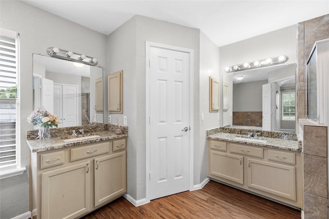 3327 Shady Glen Ln, Missouri City, TX 77459 - bathroom with wood finished floors and two vanities