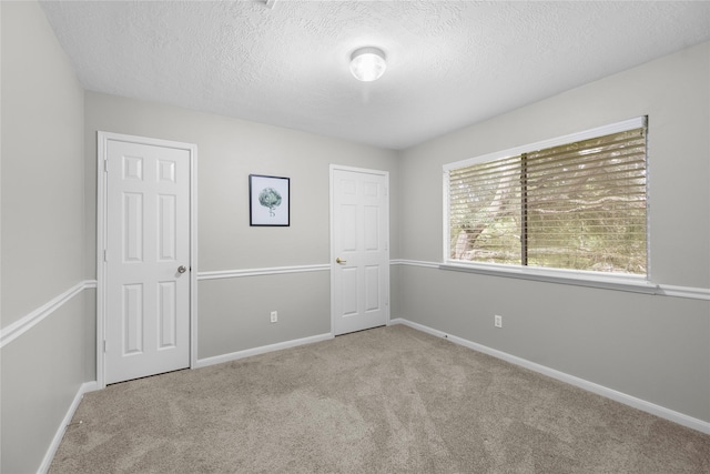 3327 Shady Glen Ln, Missouri City, TX 77459 - unfurnished bedroom with a textured ceiling and carpet flooring