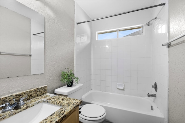 3327 Shady Glen Ln, Missouri City, TX 77459 - bathroom featuring a textured wall, vanity, and bathtub / shower combination