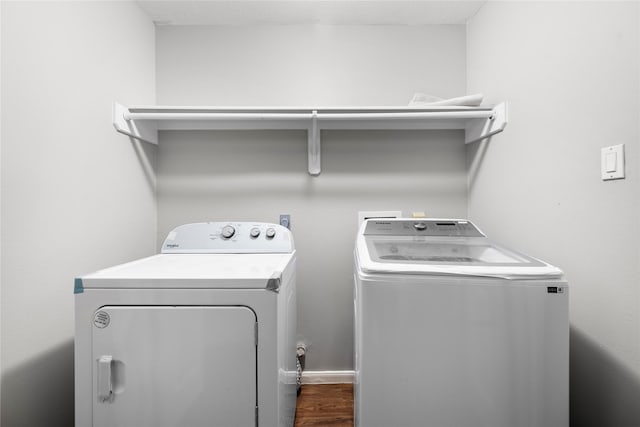 3327 Shady Glen Ln, Missouri City, TX 77459 - laundry room with washing machine and dryer and dark wood-style floors