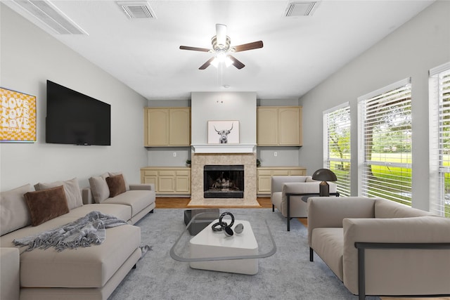 3327 Shady Glen Ln, Missouri City, TX 77459 - living room featuring ceiling fan, wood finished floors, and a fireplace