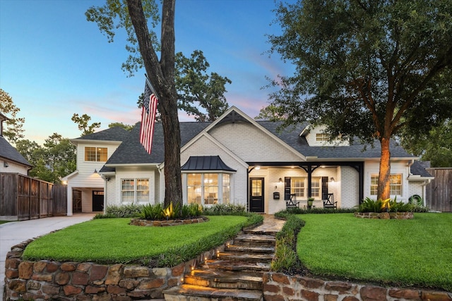 206 Lakemere St, Houston, TX 77079 - view of front facade featuring brick siding, roof with shingles, and driveway