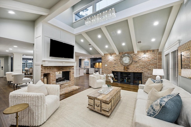 206 Lakemere St, Houston, TX 77079 - living room featuring a brick fireplace, high vaulted ceiling, beamed ceiling, wood finished floors, and recessed lighting