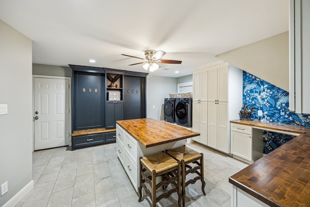 206 Lakemere St, Houston, TX 77079 - kitchen featuring wooden counters, separate washer and dryer, a ceiling fan, white cabinets, and recessed lighting