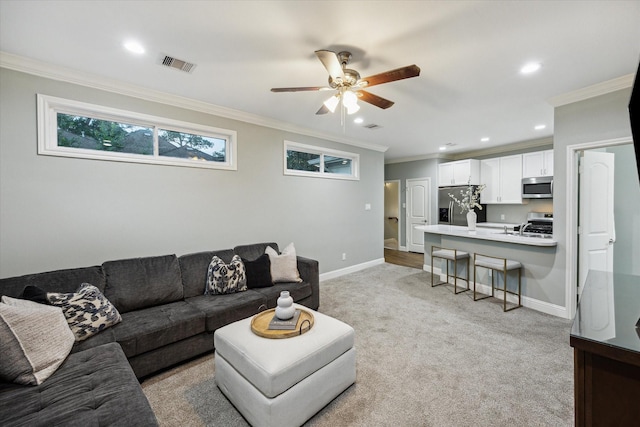 206 Lakemere St, Houston, TX 77079 - living room featuring ceiling fan, crown molding, recessed lighting, healthy amount of natural light, and light colored carpet