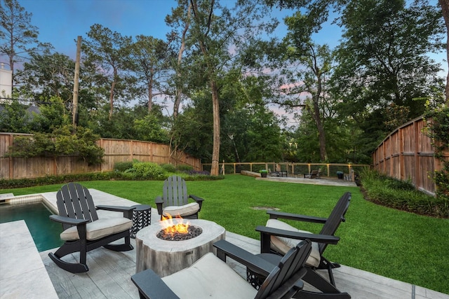 206 Lakemere St, Houston, TX 77079 - fenced backyard with a fire pit and view of scattered trees