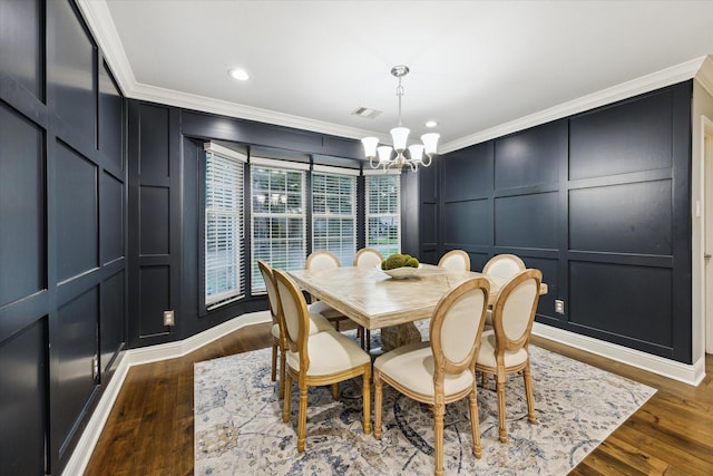 206 Lakemere St, Houston, TX 77079 - dining area with a decorative wall, ornamental molding, a chandelier, dark wood-type flooring, and recessed lighting