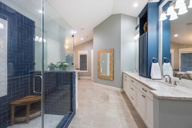206 Lakemere St, Houston, TX 77079 - bathroom with vaulted ceiling, double vanity, a shower stall, and recessed lighting