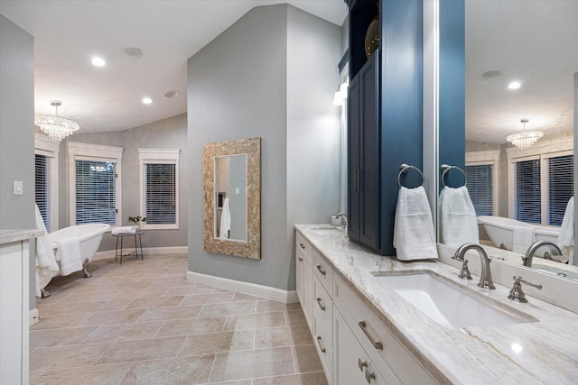 206 Lakemere St, Houston, TX 77079 - full bathroom with a chandelier, double vanity, recessed lighting, a soaking tub, and vaulted ceiling