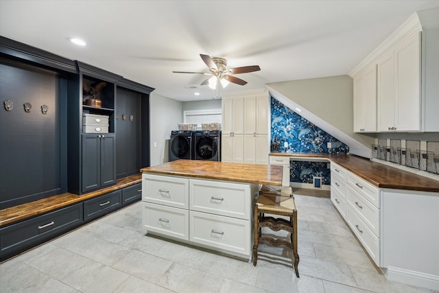 206 Lakemere St, Houston, TX 77079 - kitchen featuring butcher block counters, washer and clothes dryer, ceiling fan, white cabinetry, and wallpapered walls