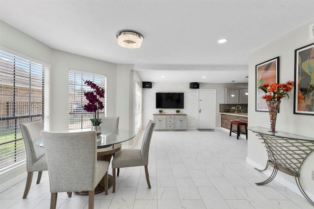 13530 Sharpbill Dr, Houston, TX 77083 - dining space with light marble finish floors and recessed lighting