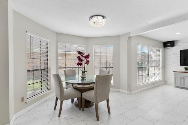 13530 Sharpbill Dr, Houston, TX 77083 - dining room with light marble finish flooring, healthy amount of natural light, and a chandelier