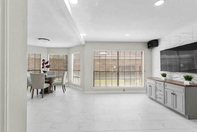 13530 Sharpbill Dr, Houston, TX 77083 - dining space featuring recessed lighting and light marble finish flooring