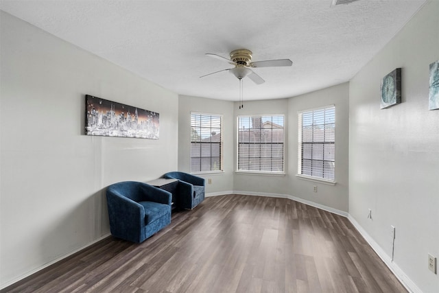 13530 Sharpbill Dr, Houston, TX 77083 - unfurnished room featuring dark wood finished floors, ceiling fan, and a textured ceiling