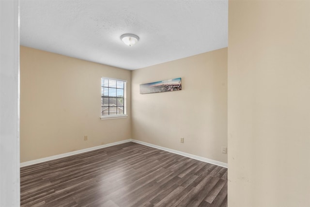 13530 Sharpbill Dr, Houston, TX 77083 - empty room with dark wood-style flooring and a textured ceiling