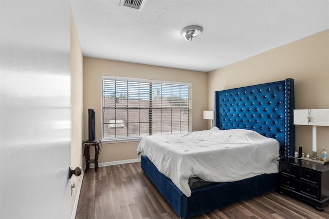 13530 Sharpbill Dr, Houston, TX 77083 - bedroom featuring wood finished floors and baseboards
