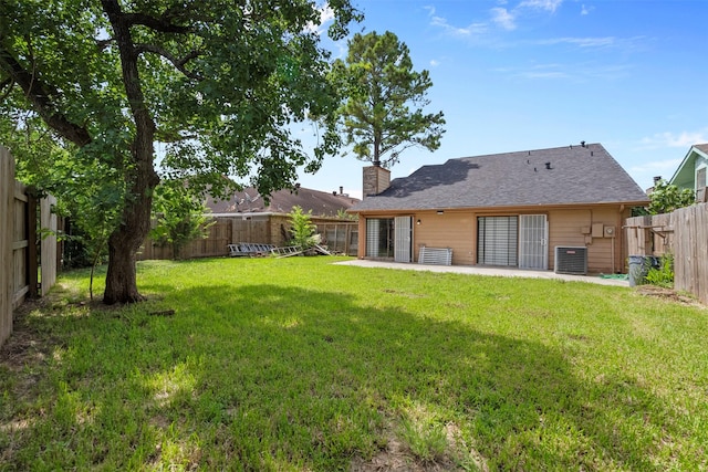 13530 Sharpbill Dr, Houston, TX 77083 - rear view of property featuring a fenced backyard, a chimney, and a patio area