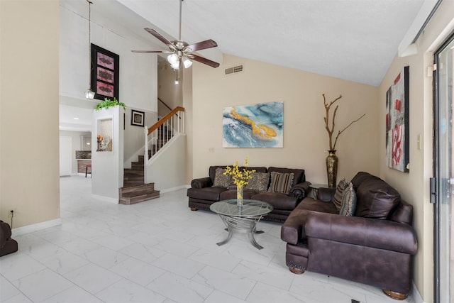 13530 Sharpbill Dr, Houston, TX 77083 - living area featuring marble look tile flooring, stairway, ceiling fan, and high vaulted ceiling