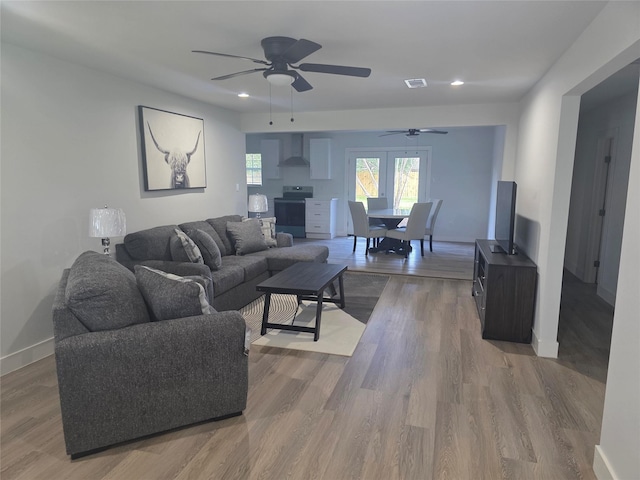 121 Tanglewood St, Baytown, TX 77520 - living area with a ceiling fan, wood finished floors, and recessed lighting