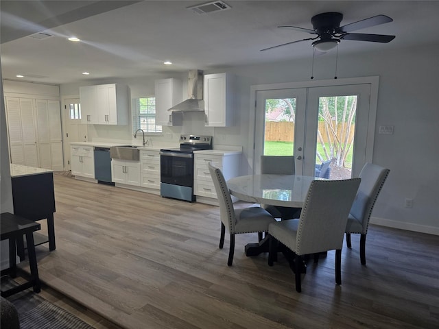 121 Tanglewood St, Baytown, TX 77520 - dining area with wood finished floors, a ceiling fan, recessed lighting, and french doors