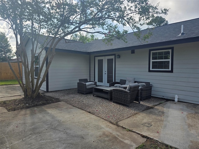 121 Tanglewood St, Baytown, TX 77520 - rear view of house featuring french doors, outdoor lounge area, a patio area, and a shingled roof