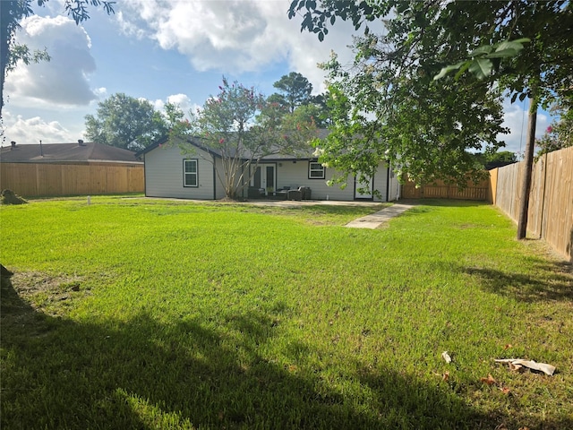121 Tanglewood St, Baytown, TX 77520 - fenced backyard with a patio