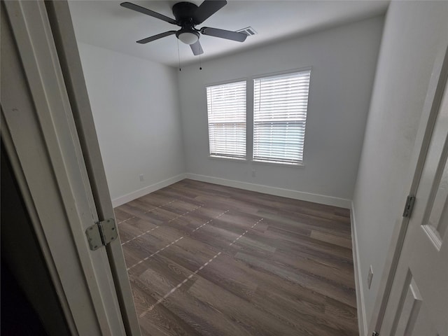 121 Tanglewood St, Baytown, TX 77520 - empty room featuring a ceiling fan and dark wood-type flooring
