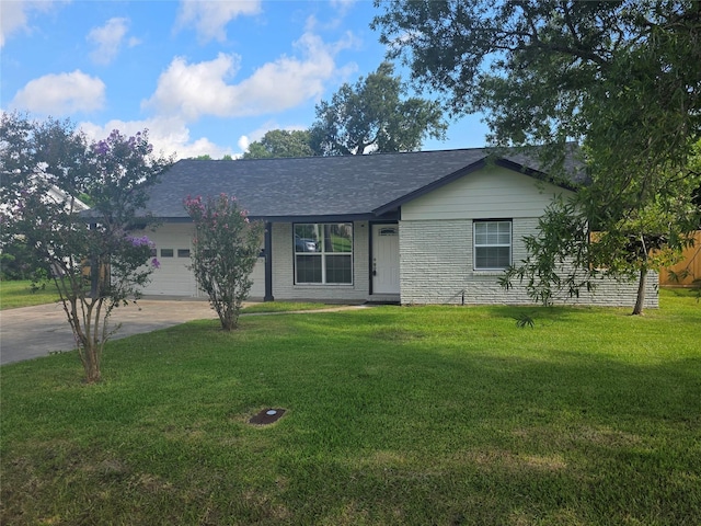 121 Tanglewood St, Baytown, TX 77520 - single story home featuring a garage, a front lawn, concrete driveway, and a shingled roof