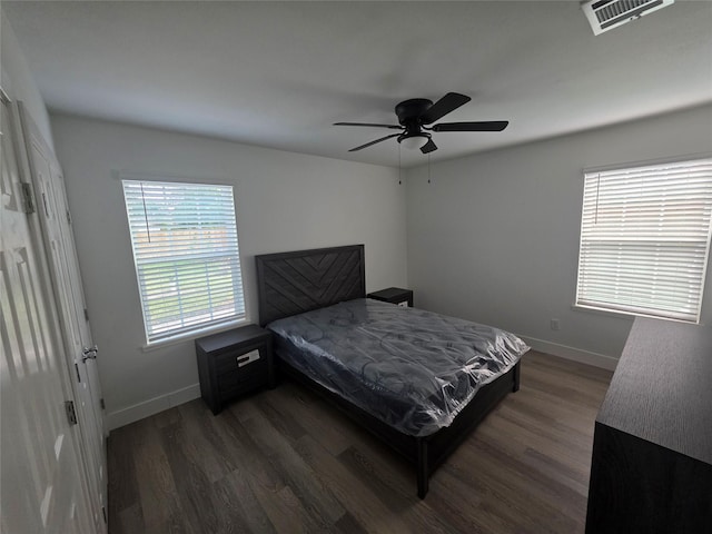 121 Tanglewood St, Baytown, TX 77520 - bedroom with dark wood finished floors and a ceiling fan